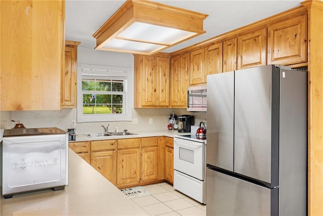 1819 Cheryl Dr, Caldwell, TX 77836 - kitchen featuring appliances with stainless steel finishes, light countertops, light tile patterned floors, and tasteful backsplash