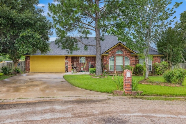 1819 Cheryl Dr, Caldwell, TX 77836 - view of front of home featuring driveway, a garage, brick siding, a front yard, and roof with shingles