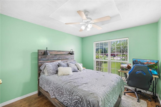 1819 Cheryl Dr, Caldwell, TX 77836 - bedroom featuring wood finished floors, ceiling fan, and an office area