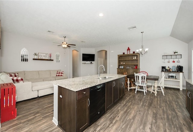 kitchen featuring dark brown cabinets, dark wood-type flooring, black dishwasher, arched walkways, and a sink