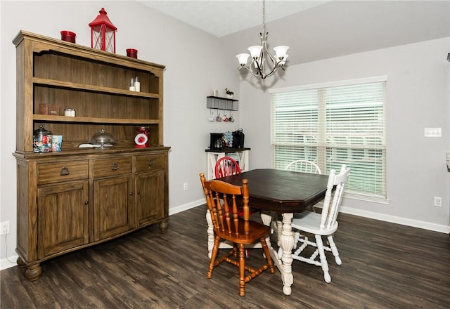 dining area with baseboards, dark wood-type flooring, and an inviting chandelier