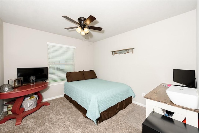 carpeted bedroom with baseboards and ceiling fan