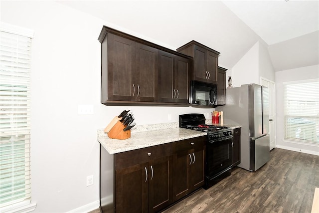 kitchen with baseboards, dark wood finished floors, lofted ceiling, black appliances, and dark brown cabinetry