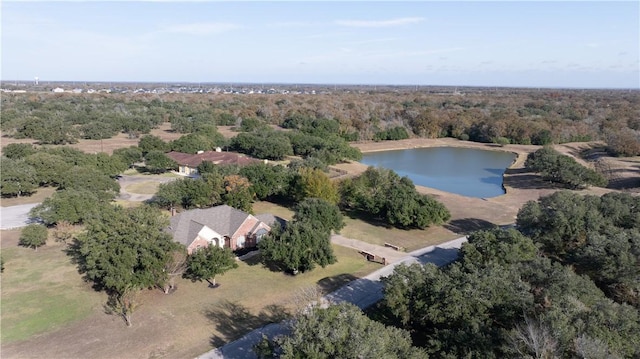 aerial view featuring a water view and a view of trees