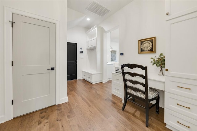 4435 Williams Lake Dr, College Station, TX 77845 - office with vaulted ceiling, built in desk, light wood finished floors, visible vents, and recessed lighting