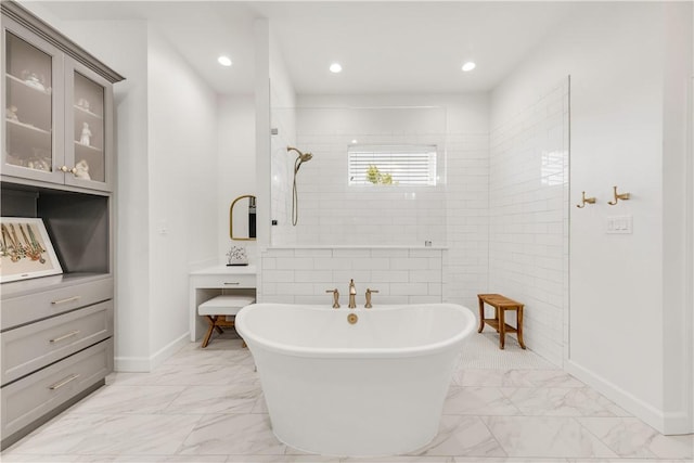 4435 Williams Lake Dr, College Station, TX 77845 - bathroom featuring baseboards, recessed lighting, walk in shower, a freestanding tub, and marble finish floor