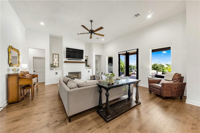 4435 Williams Lake Dr, College Station, TX 77845 - living area with recessed lighting, a towering ceiling, visible vents, a fireplace, and ceiling fan