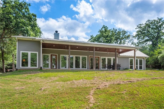 11188 Riley Green Rd, Franklin, TX 77856 - back of property with a chimney and a lawn