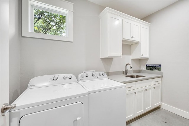 11188 Riley Green Rd, Franklin, TX 77856 - laundry area with cabinet space and washing machine and clothes dryer