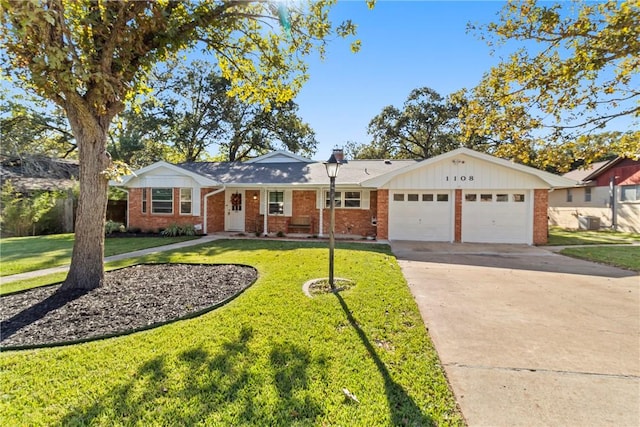 ranch-style home featuring a front lawn and a garage