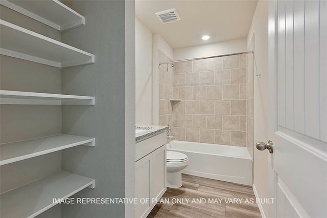 205 Rockbridge Dr, Huntsville, TX 77340 - full bath with wood finished floors, vanity, bathtub / shower combination, and recessed lighting