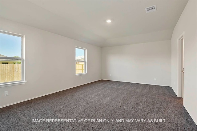 205 Rockbridge Dr, Huntsville, TX 77340 - empty room with dark colored carpet and recessed lighting