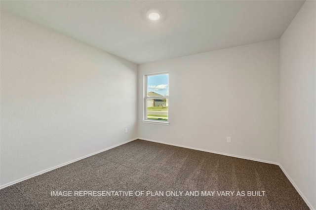205 Rockbridge Dr, Huntsville, TX 77340 - spare room with dark carpet