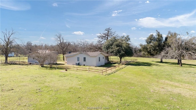 view of yard with a rural view