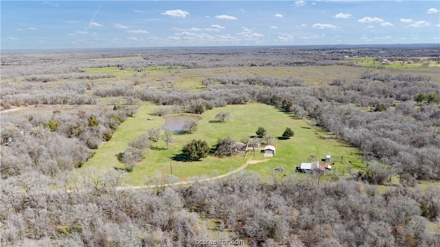 birds eye view of property with a rural view