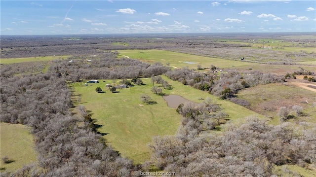 birds eye view of property featuring a rural view