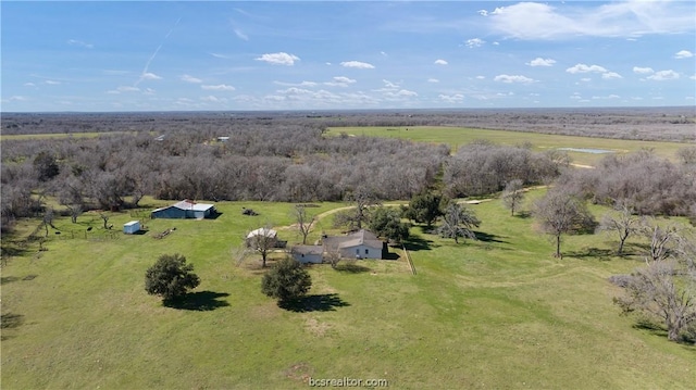 birds eye view of property featuring a rural view