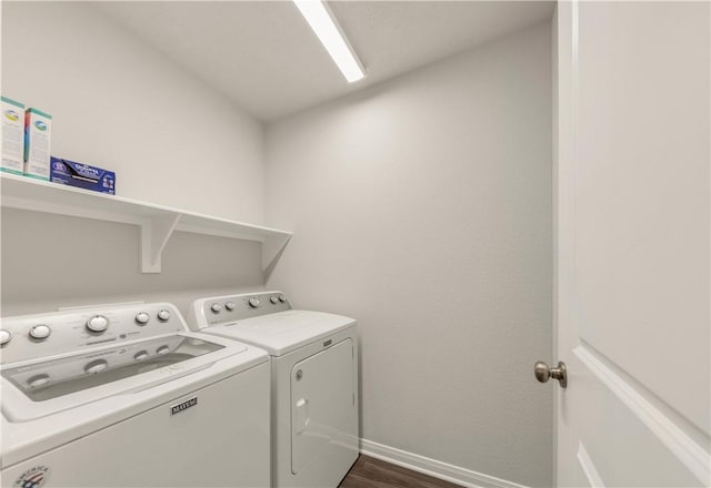 laundry room featuring independent washer and dryer and dark hardwood / wood-style flooring