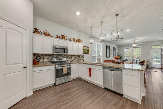 kitchen featuring white cabinetry, sink, and stainless steel appliances