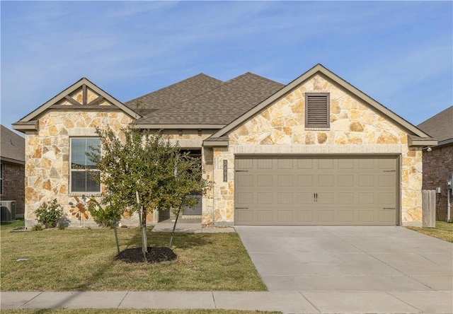 view of front of house featuring a garage, central AC, a shingled roof, concrete driveway, and a front lawn