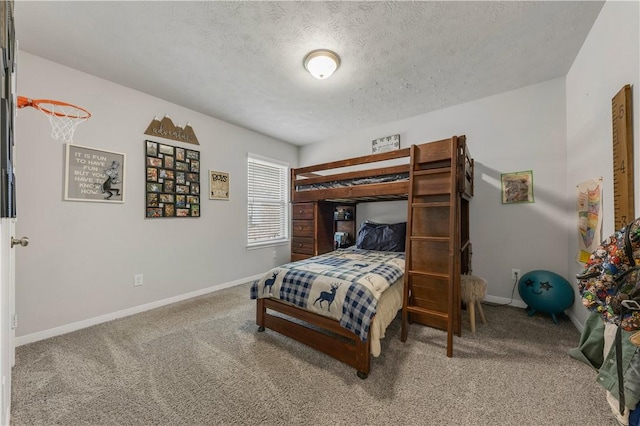 carpeted bedroom with a textured ceiling