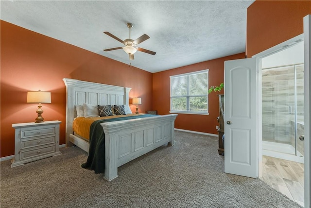 carpeted bedroom featuring ceiling fan and a textured ceiling