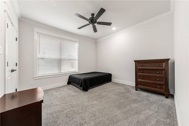 bedroom featuring crown molding, ceiling fan, and light carpet