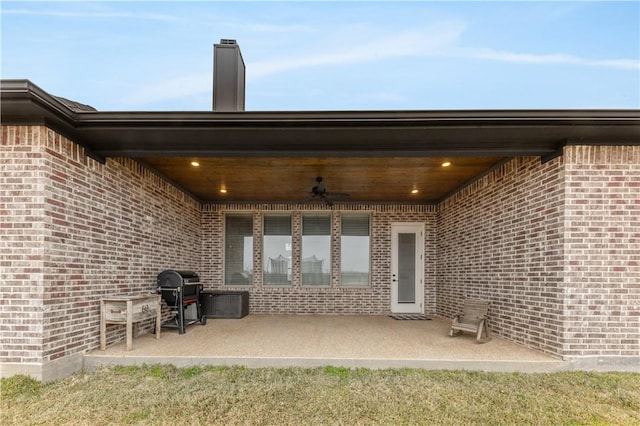 view of patio / terrace with grilling area and ceiling fan