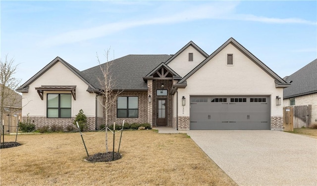 view of front facade featuring a garage and a front lawn