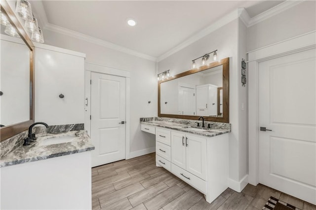 bathroom with vanity and crown molding