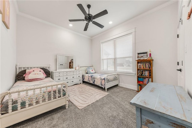 bedroom with ceiling fan, ornamental molding, and carpet floors