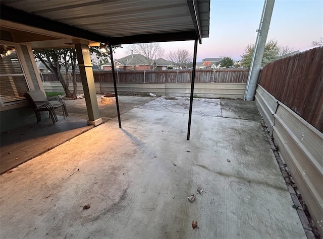 view of patio terrace at dusk