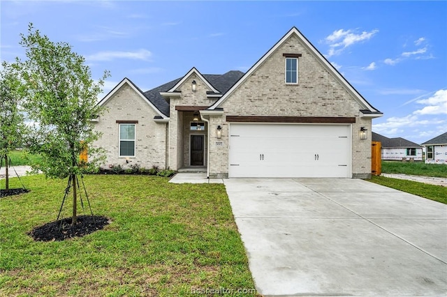 view of front facade featuring a garage and a front lawn