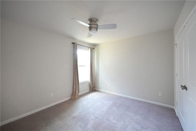 2135 Dumfries Dr, Bryan, TX 77807 - spare room featuring light carpet, ceiling fan, and baseboards