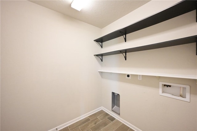 2135 Dumfries Dr, Bryan, TX 77807 - laundry room with washer hookup, baseboards, wood finish floors, and electric dryer hookup
