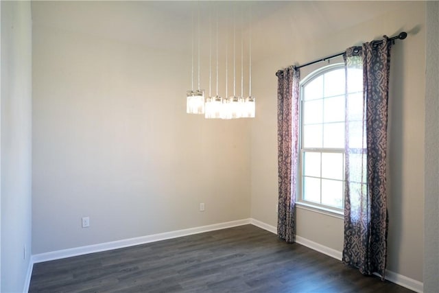 2135 Dumfries Dr, Bryan, TX 77807 - unfurnished room featuring plenty of natural light, dark wood-style flooring, and baseboards
