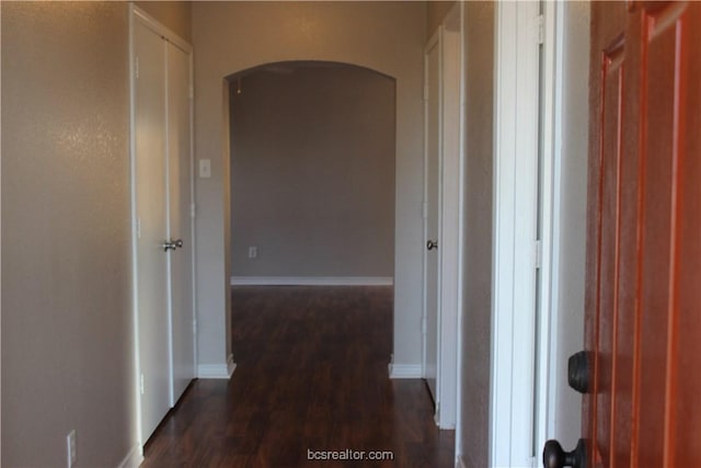 4031 Southern Trace Dr, College Station, TX 77845 - corridor featuring arched walkways, dark wood-style flooring, and baseboards
