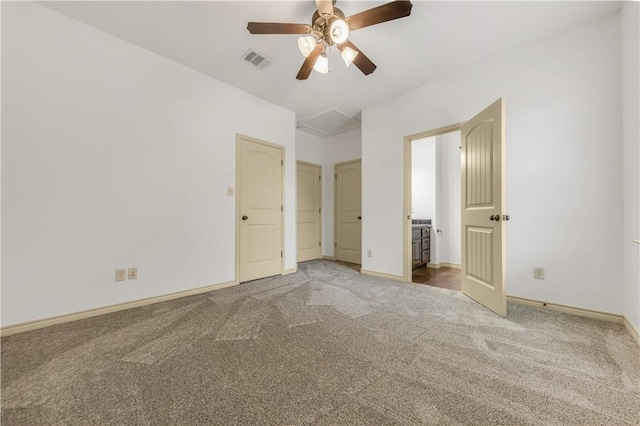 unfurnished bedroom with baseboards, visible vents, ceiling fan, and carpet flooring