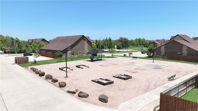 view of home's community with fence
