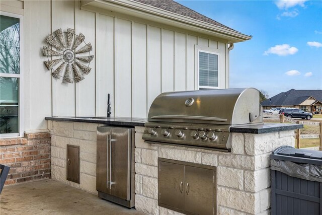 view of patio / terrace featuring sink, grilling area, and exterior kitchen