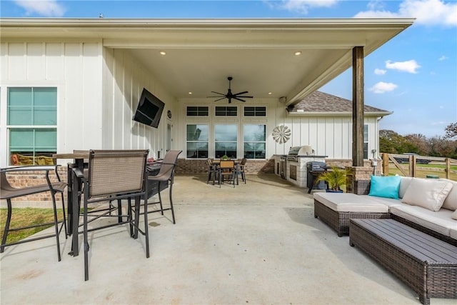 view of patio / terrace featuring outdoor lounge area, an outdoor kitchen, and ceiling fan