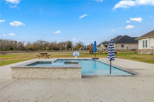 view of swimming pool featuring an in ground hot tub and a yard