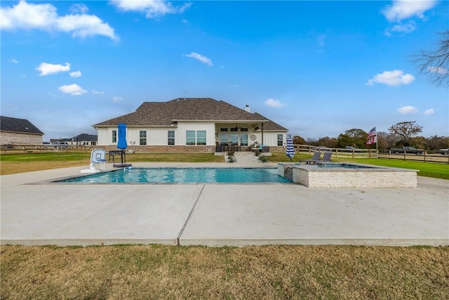 view of swimming pool with a yard and a patio area