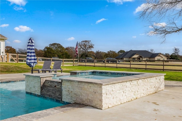 view of swimming pool with a lawn and an in ground hot tub