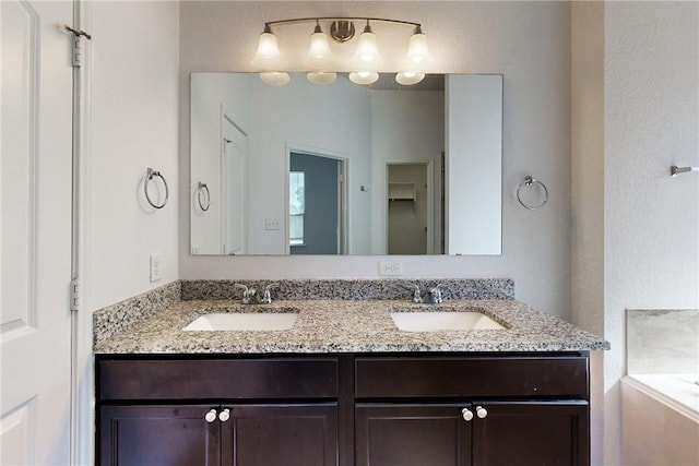 2038 Sorrento Ct, Bryan, TX 77808 - bathroom featuring a bathing tub and vanity