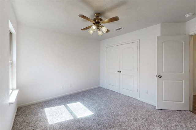 2038 Sorrento Ct, Bryan, TX 77808 - unfurnished bedroom featuring ceiling fan, carpet floors, and a closet