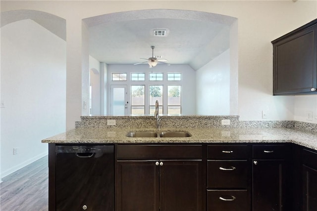 kitchen featuring vaulted ceiling, ceiling fan, sink, black dishwasher, and light hardwood / wood-style floors