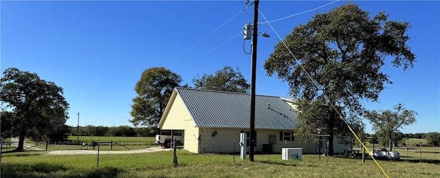 view of home's exterior featuring a lawn