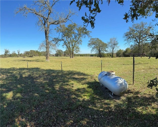 view of yard with a rural view