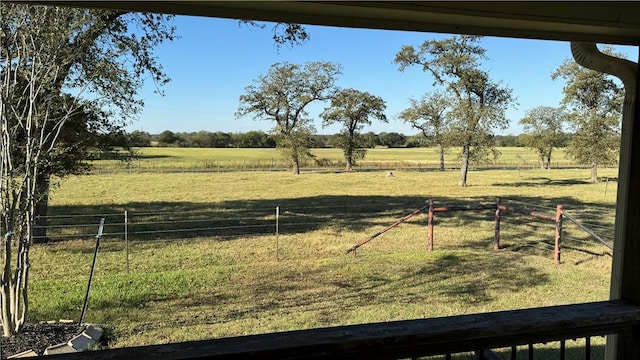 view of yard with a rural view